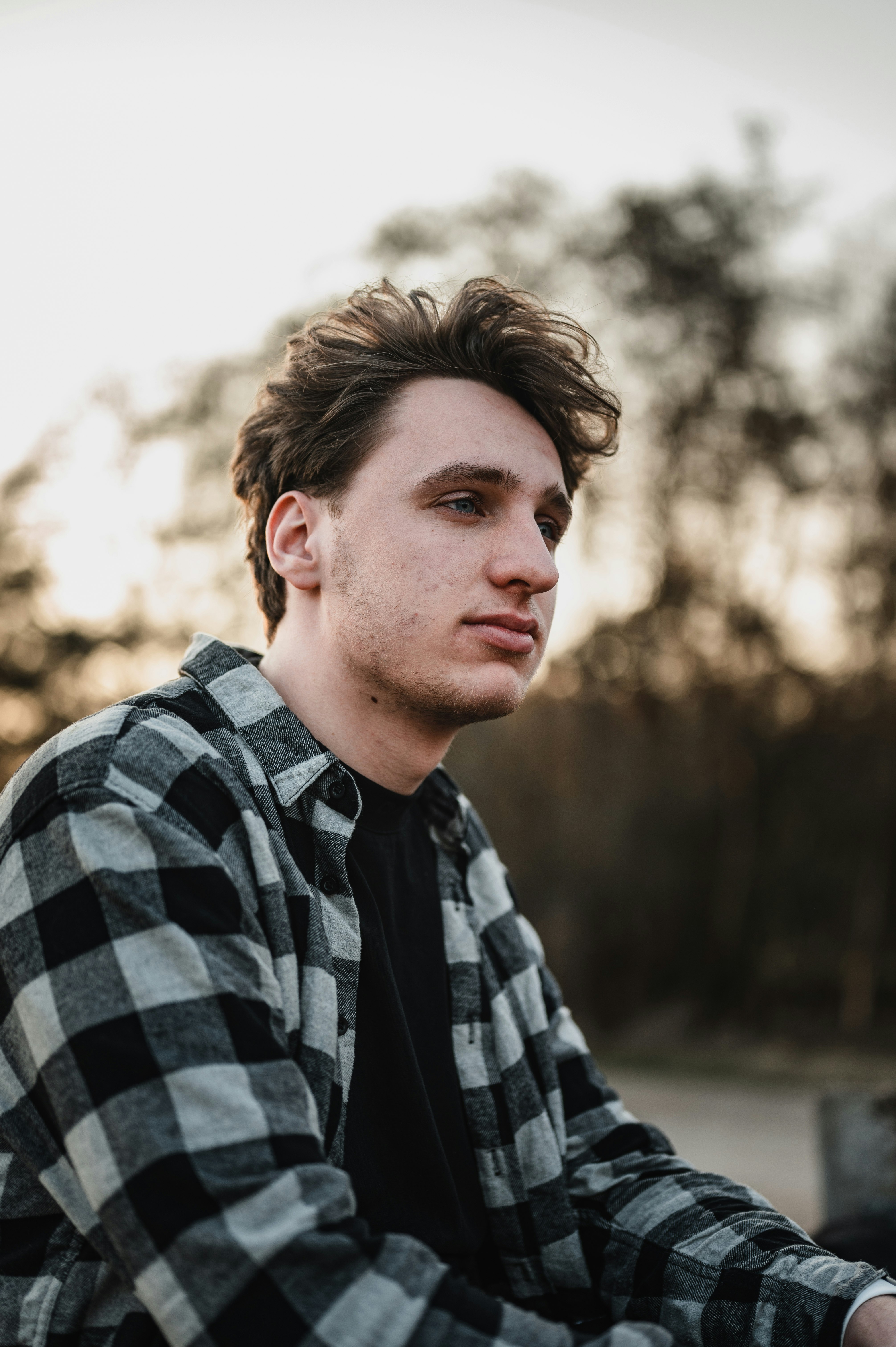 man in black and white plaid dress shirt